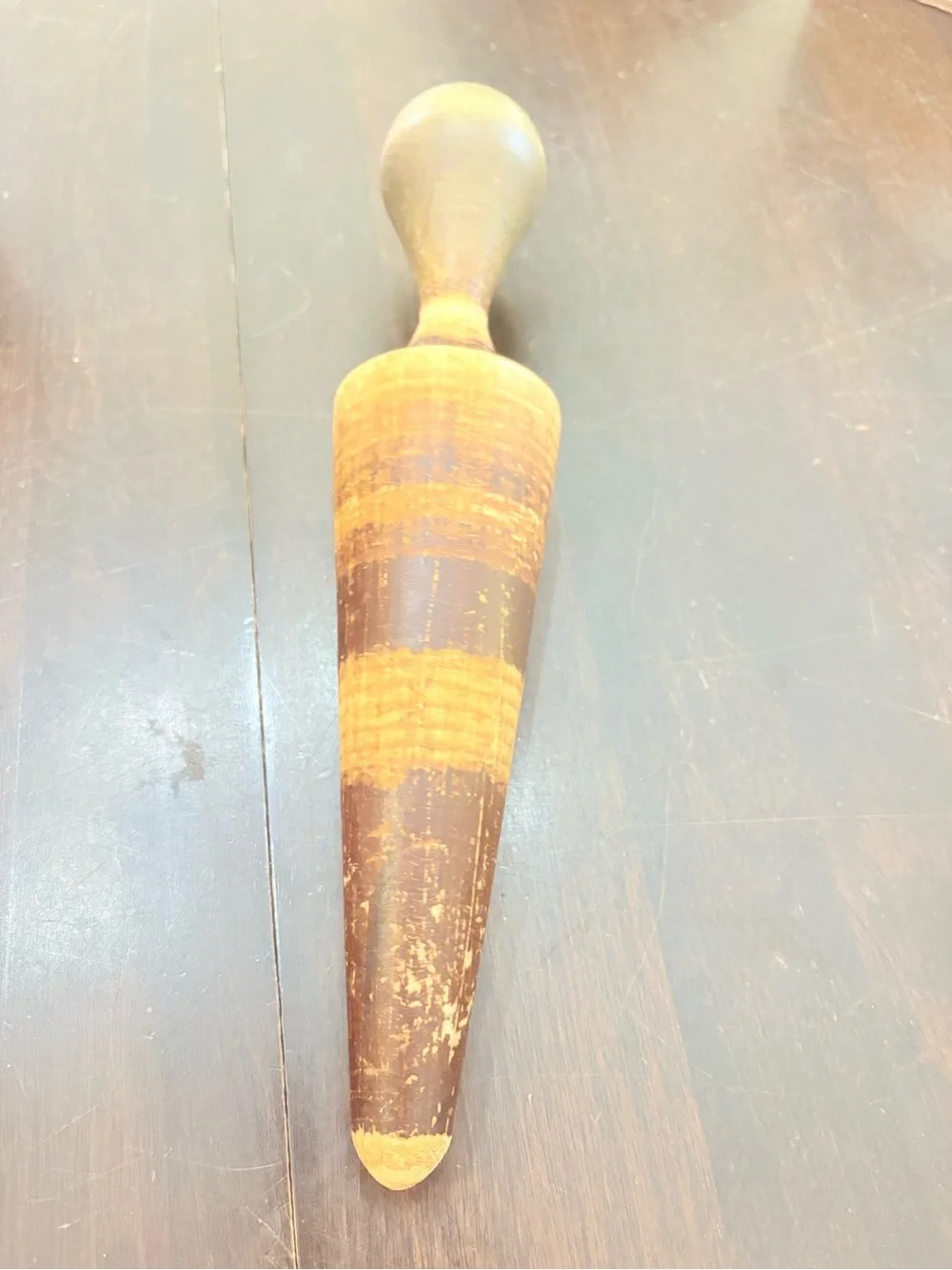 vintage wooden cone-shaped pestle or masher